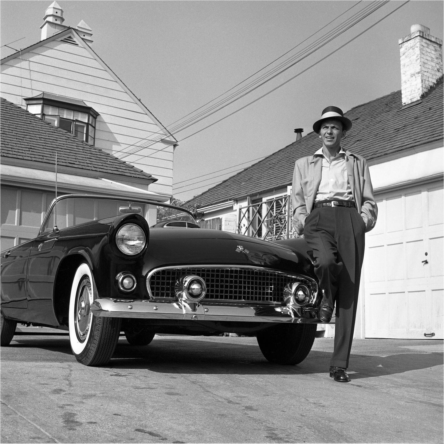 Frank Sinatra Standing on Ford Thunderbird